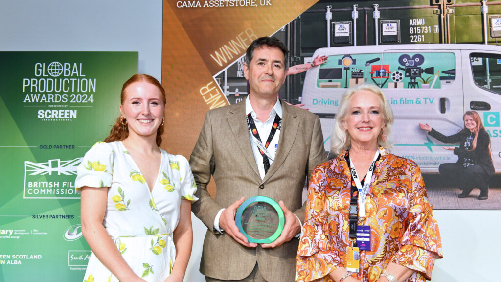 Film equipment storage area with organized shelves and equipment bins.